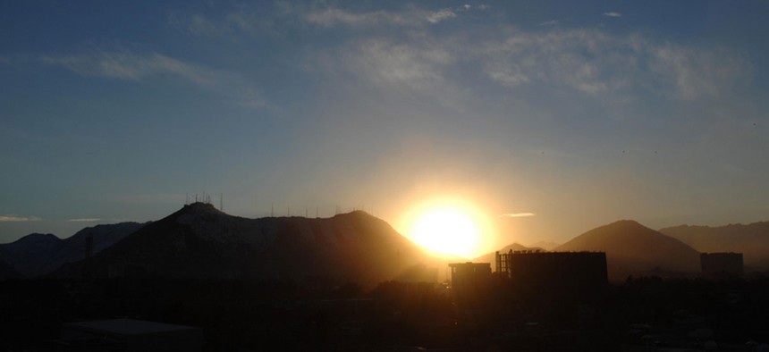 The sun sets near Kabul in 2011.