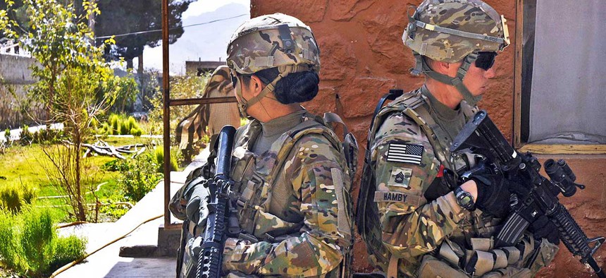 Army Pvt. 1st Class Jo Marie Rivera, left, a human resource specialist, and Sgt. 1st Class Rebecca Hamby, a military police officer, both with the 3rd Brigade Combat Team, maintain security in Afghanistan in 2013
