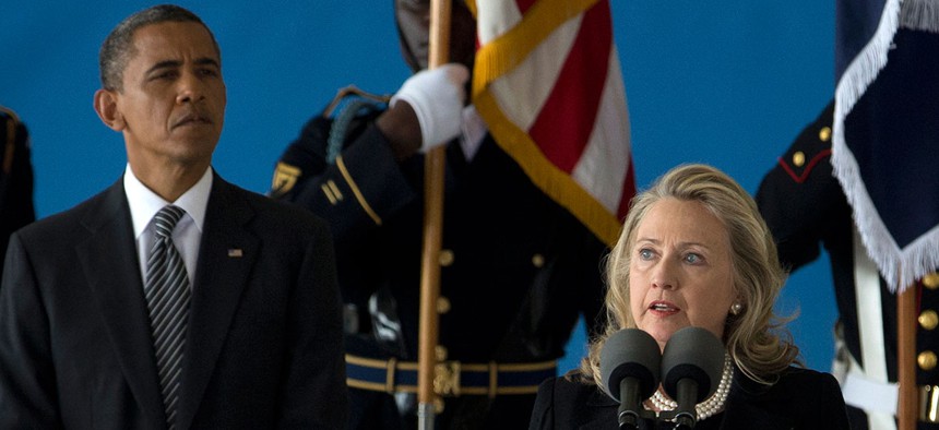 Clinton and Obama appear together at Andrews Air Force Base in 2012.
