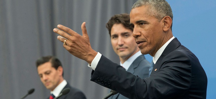 President Barack Obama, accompanied by Canadian Prime Minister Justin Trudeau and Mexican President Enrique Pena Neito, speaks during their trilateral news conference for the North America Leaders' Summit in Ottawa Wednesday.