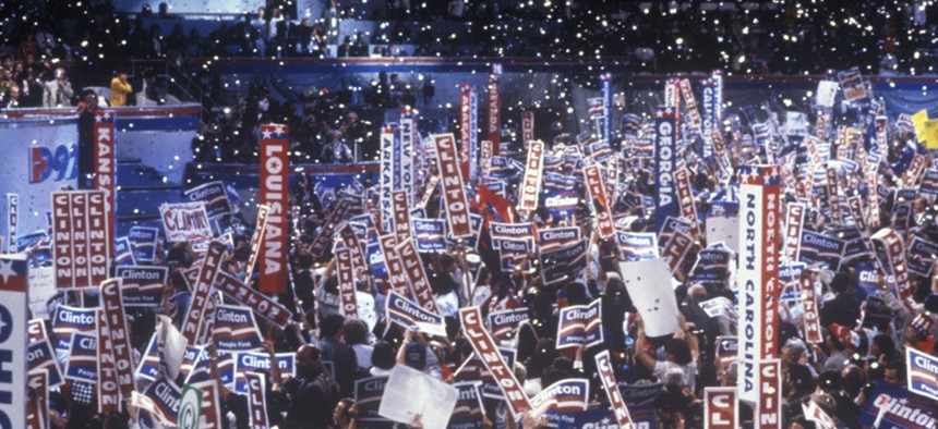 Delegates and attendees cheer for Bill Clinton at the 1992 Democratic National Convention.