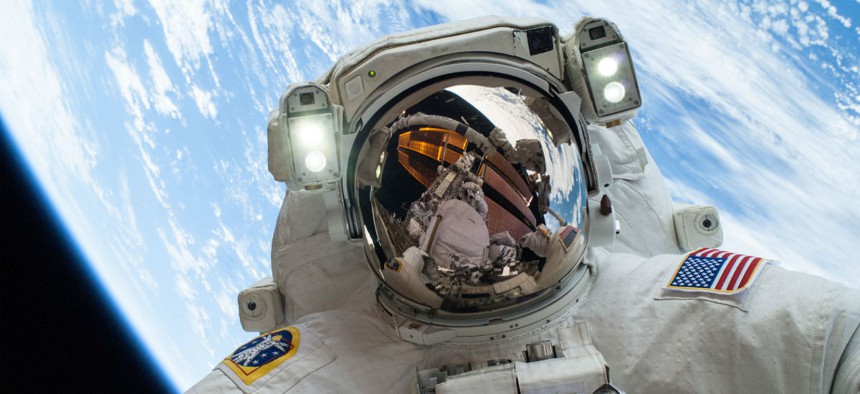 NASA astronaut Mike Hopkins participates in the second of two spacewalks to change out a faulty water pump on the International Space Station in 2014. 