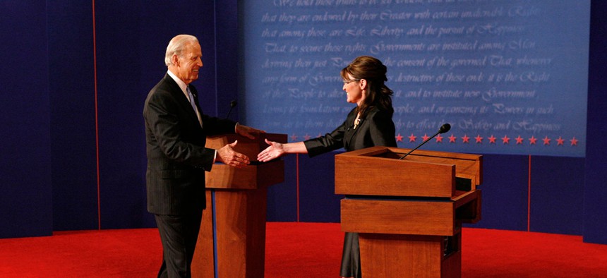 Joe Biden and Sarah Palin green each other before they debate in 2008.