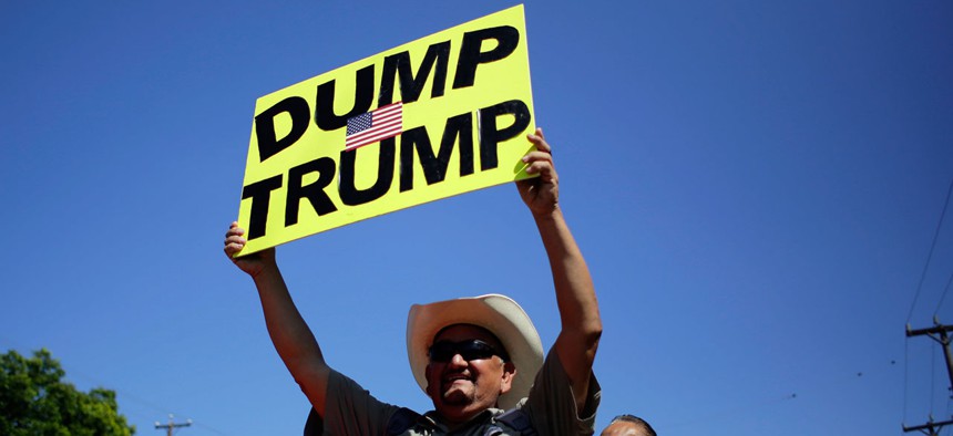 A protestor holds a sign in Texas July 17.