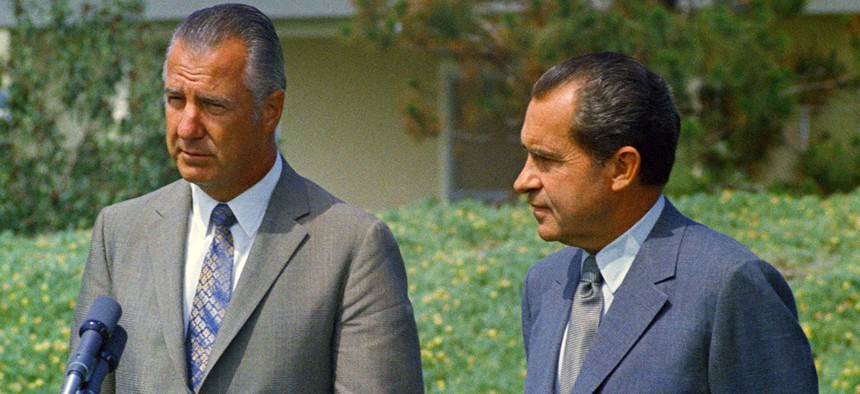 Spiro Agnew and Richard Nixon address the press in 1970.