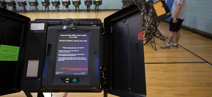 A electronic voting machine waits to be used at the Schiller Recreation Center polling station on election day in 2015.