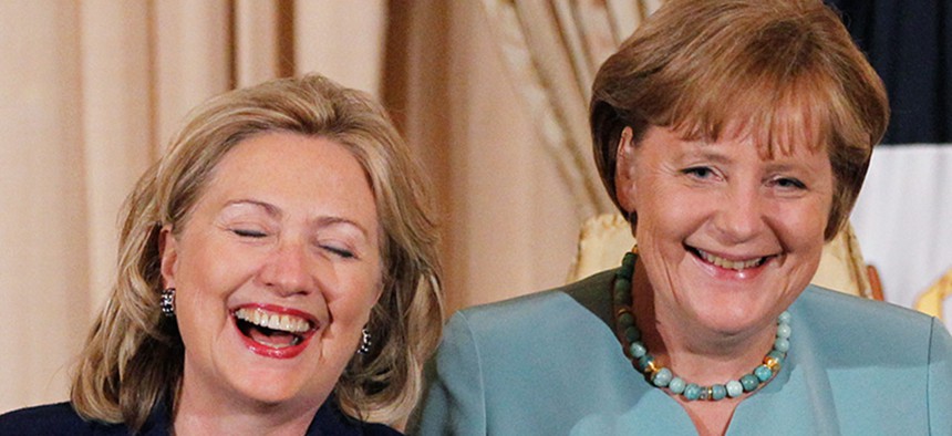 Hillary Clinton and German Chancellor Angela Merkel laugh during a State Luncheon in honor of the German chancellor at the State Department in 2011.