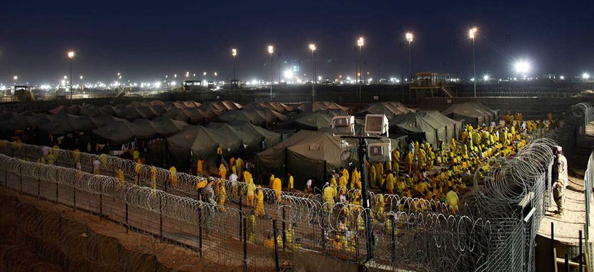 Detainees pray at U.S. military detention facility Camp Bucca, Iraq, in 2009.