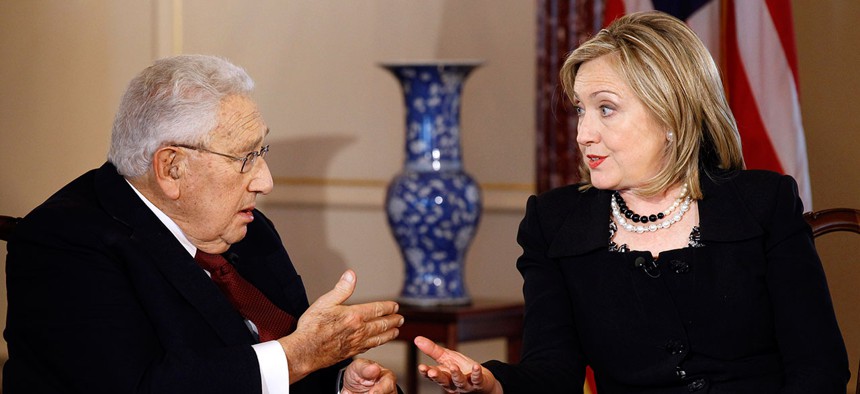Former Secretary of State Henry Kissinger and Secretary of State Hillary Rodham Clinton talk during an interview by PBS' Charlie Rose in 2011.