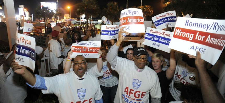 Members of the American Federation of Government Employees protest the GOP presidential ticket in 2012 in Daytona Beach, Fla.