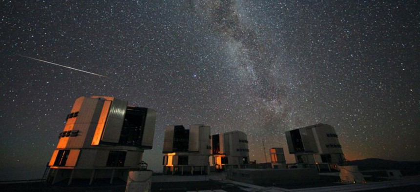 A Perseid seen in August 2010 above the four enclosures of the European Southern Observatory's Very Large Telescope at Paranal, Chile.