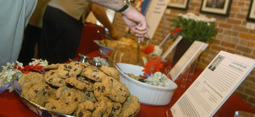 A plate of chocolate chip cookies, made from Hillary Clinton's recipe, is surrounded by food made from recipes from various family and friends of Clinton and former President Bill Clinton, in 2003.