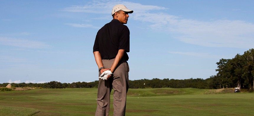 Obama golfs while on vacation in 2009.