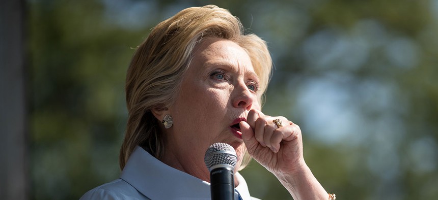 Hillary Clinton coughs during a speech in Cleveland on Monday.