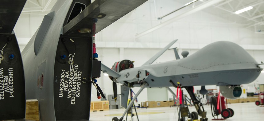 An MQ-9 Reaper sits in a hangar prior to having the wings put on at Holloman Air Force Base in 2015.
