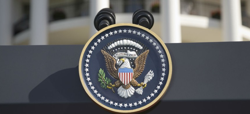 The Presidential Seal on a podium in front of the South Portico of the White House.