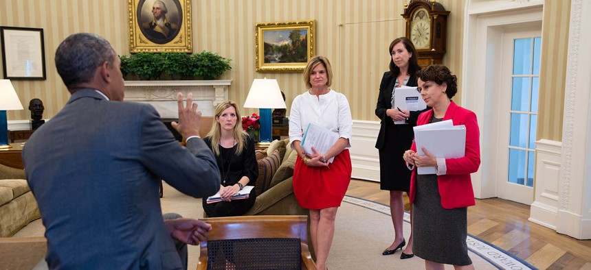 Obama meets with staffers in 2013. From left: Kathryn Ruemmler, Counsel to the President; Communications Director Jennifer Palmieri; Katie Beirne Fallon, Deputy Director of Communications; and Cecilia Muñoz, Director of the Domestic Policy Council. 