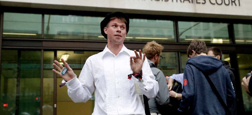 Lauri Love, who is accused of hacking into U.S. government computers, waits outside Westminster Magistrates' Court before the ruling that he should be extradited Friday.
