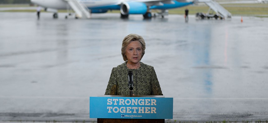 Hillary Clinton speaks with members of the media at Westchester County Airport on Monday.