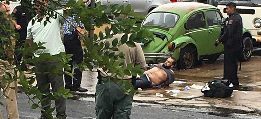 Ahmad Khan Rahami is taken into custody after a shootout with police Monday.