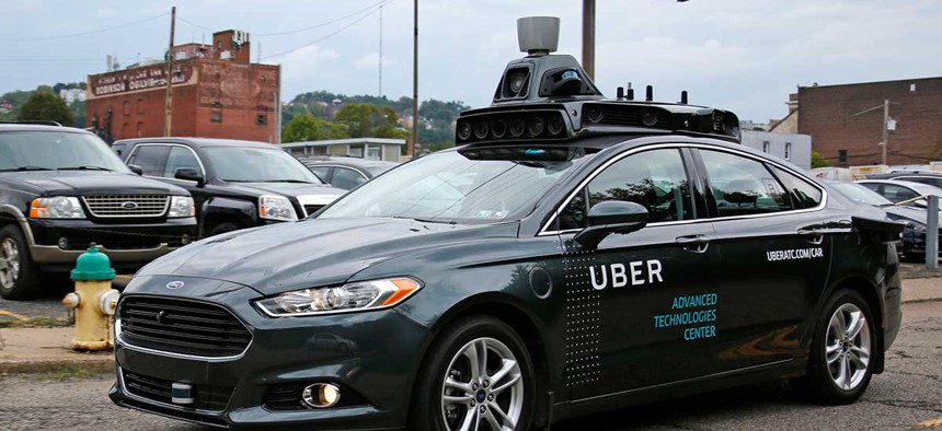 A self-driving Uber car drives in Pittsburgh on Sept. 14.