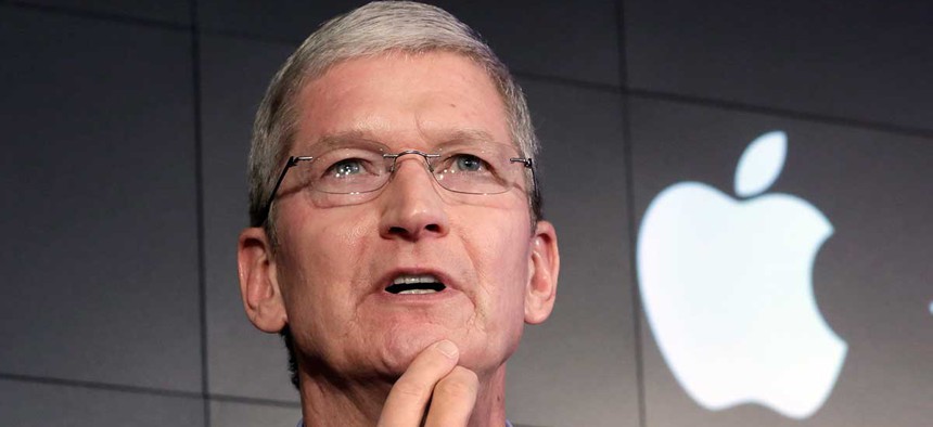 Tim Cook responds to a question during a news conference in New York in 2015.