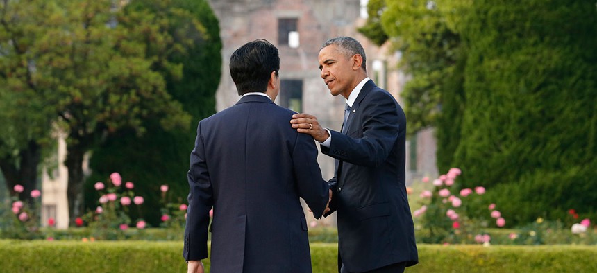  Barack Obama, right, bids farewell to Japanese Prime Minister Shinzo Abe as they take a closer look at the Atomic Bomb Dome after laying wreaths at the cenotaph for victims of the 1945 atomic bombing at Hiroshima Peace Memorial Park in September.