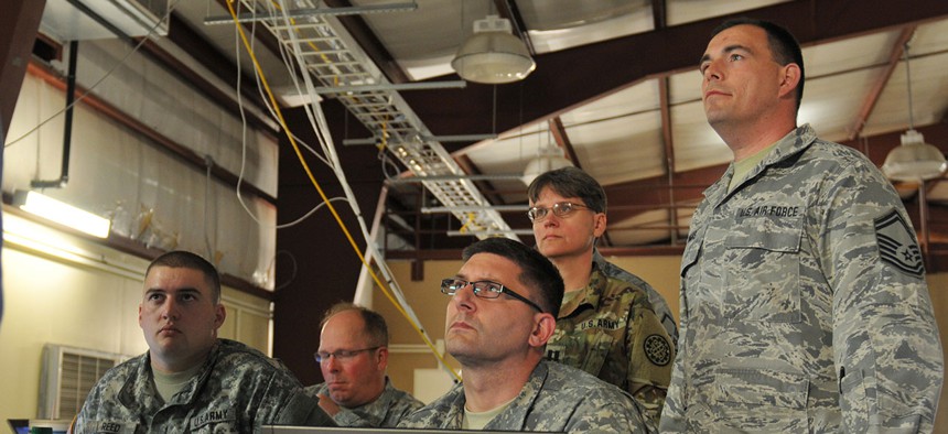 National Guard soldiers and airmen of the Blue Team listen to their team leader Cyber Shield 2016 at Camp Atterbury, Ind. April 20, 2016.