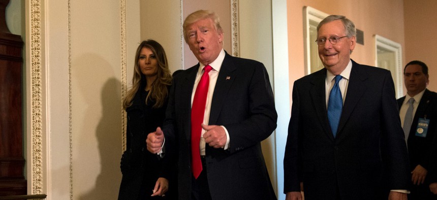 President-Elect Donald Trump walks with his wife, Melania, and Senate Majority Leader Mitch McConnell  during his visit to Capitol Hill last week.