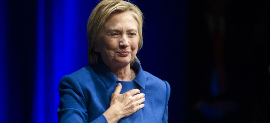 Hillary Clinton places her hand over her heart as she walks to the podium to address members of the Children's Defense Fund in Washington on Nov. 16.