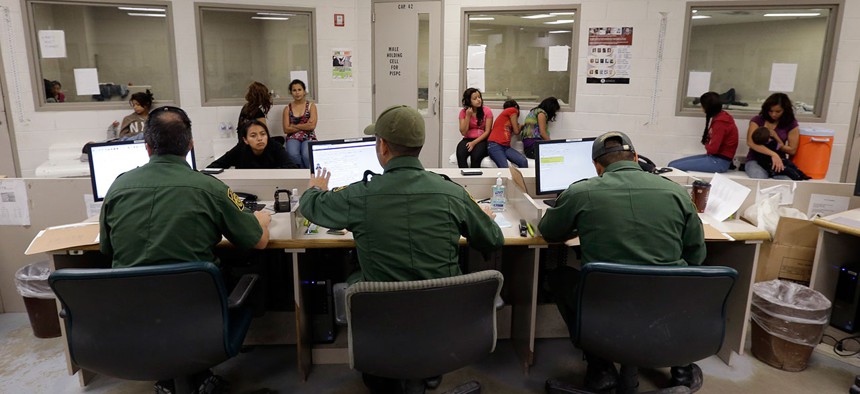 U.S. Customs and Border Protection agents work at a processing facility in 2012 in Texas.