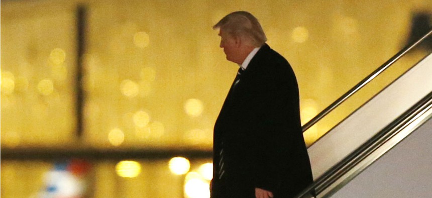 President-elect Donald Trump walks down the stairs from his plane after returning from Wisconsin to LaGuardia Airport Dec. 13.