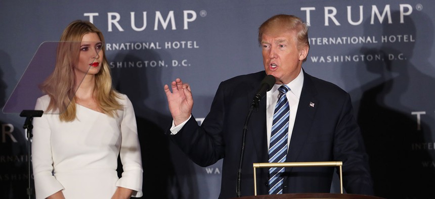 Donald Trump, accompanied by his daughter, Ivanka Trump, speaks during the grand opening of Trump International Hotel in Washington in October.