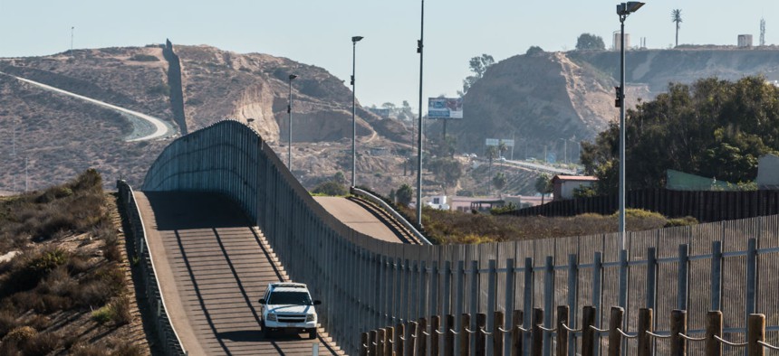 A Border Patrol vehicle patrols the international border between San Diego and Tijuana, Mexico.