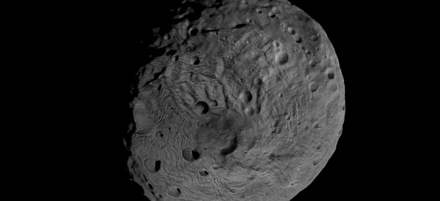 Vesta, a rocky asteroid orbiting between between Mars and Jupiter