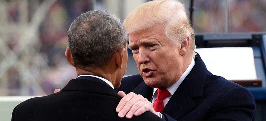President Donald Trump talks with former President Barack Obama on Capitol Hill after Trump took the presidential oath