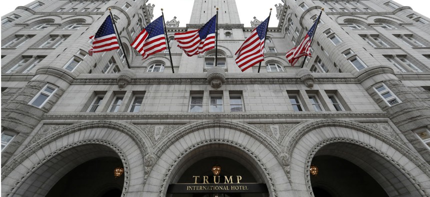 Trump's stake in the Trump International Hotel in Washington creates a conflict of interest for the new president, government ethics officials have said.