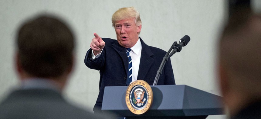 President Donald Trump points to a member of the audience after speaking at the Central Intelligence Agency Saturday.