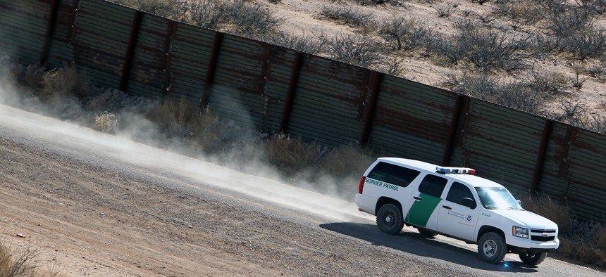 A Border Patrol truck secures border fence line in Arizona in 2011.