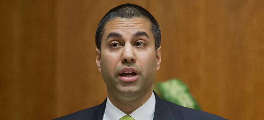 FCC chief Ajit Pai speaks during a 2015 hearing on net neutrality. 