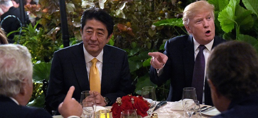 Donald Trump sits down to dinner with Japanese Prime Minister Shinzō Abe, second from left, at Mar-a-Lago in Florida on Friday, Feb. 10.