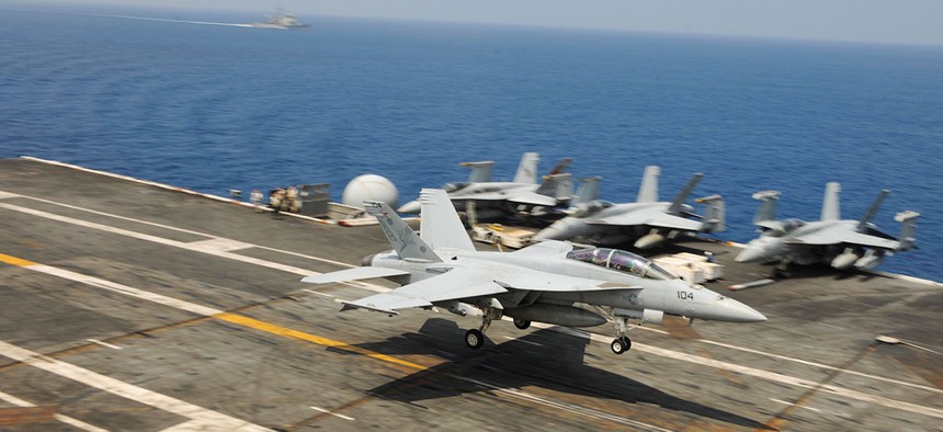  An F/A-18F Super Hornet, assigned to the Red Rippers of Strike Fighter Squadron (VFA) 11, lands on the flight deck of the aircraft carrier USS Theodore Roosevelt (CVN 71) in 2015.