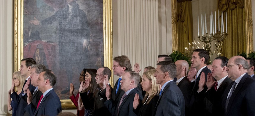 Senior White House officials are sworn in on Jan. 22. 