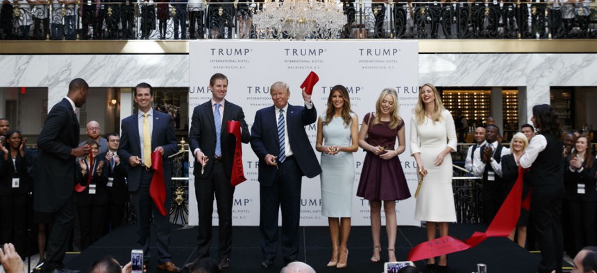 Donald Trump and family members attend the grand opening of Trump International Hotel in October. 