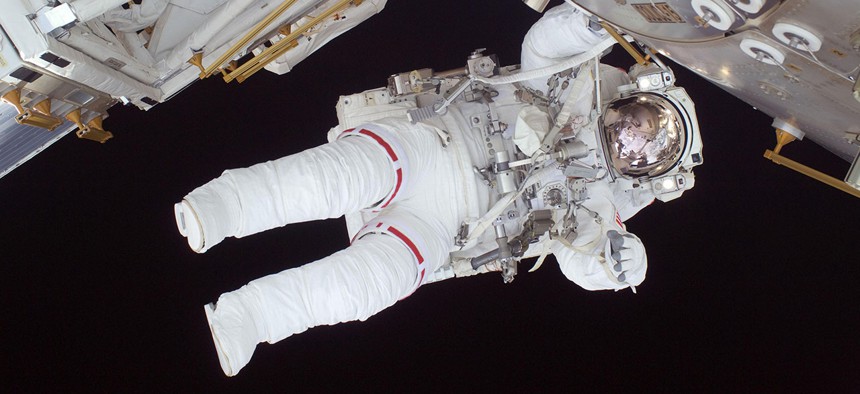 Astronaut Nicole Stott participates in the STS-128 mission's first spacewalk as construction and maintenance continue on the International Space Station in 2015.