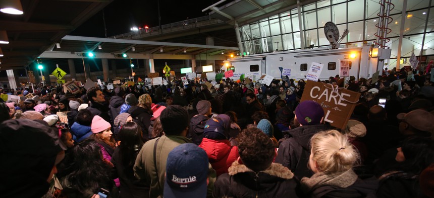 Activists protest the travel ban in January at New York's JFK Airport.
