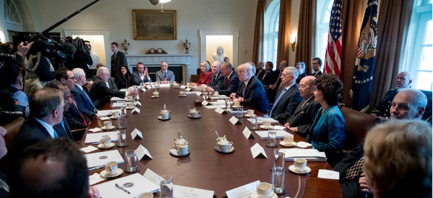 President Trump meets with his cabinet in March.