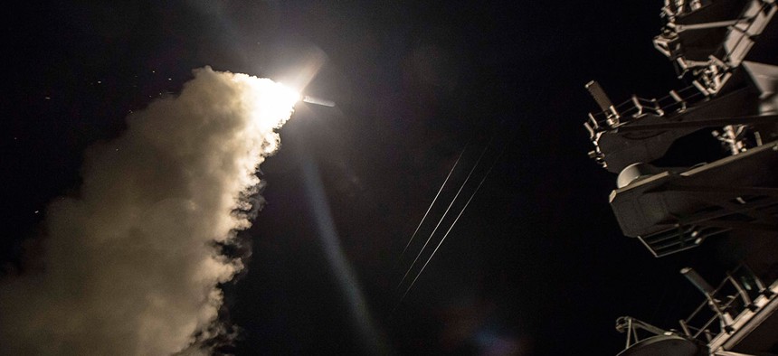 USS Ross (DDG 71) fires a tomahawk land attack missile April 7.