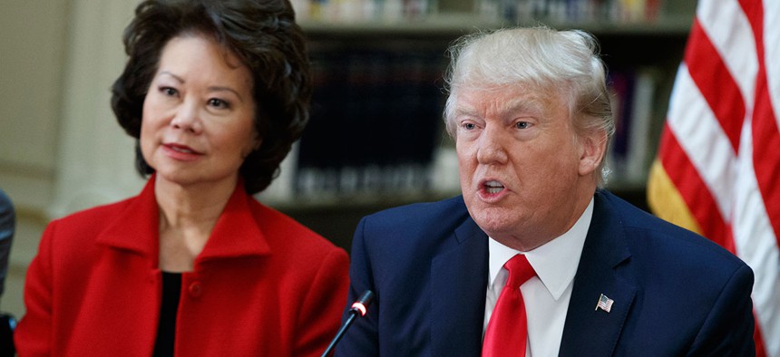 President Trump and Transportation Secretary Elaine Chao at a White House meeting with business leaders April 11.