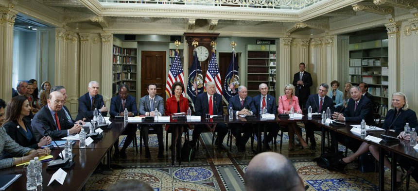 President Trump meets with business leaders in the Eisenhower Executive Office Building April 11 to discuss how to make government more efficient.